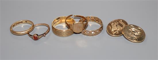 Five 9ct gold rings, including one set small diamonds, one agate-set and one textured and a single 9ct gold cufflink.